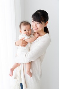 asian baby and mother relaxing